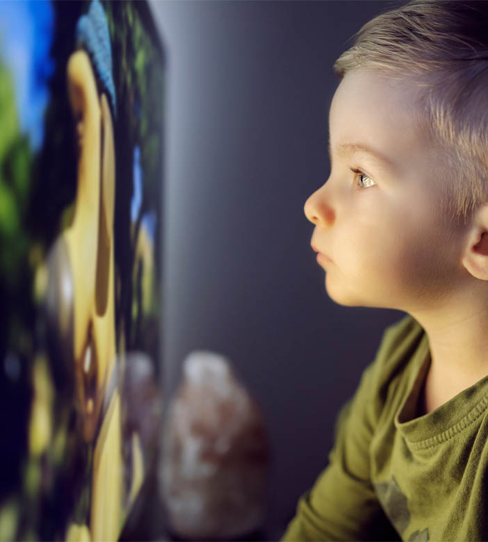 Boy sitting too close to television