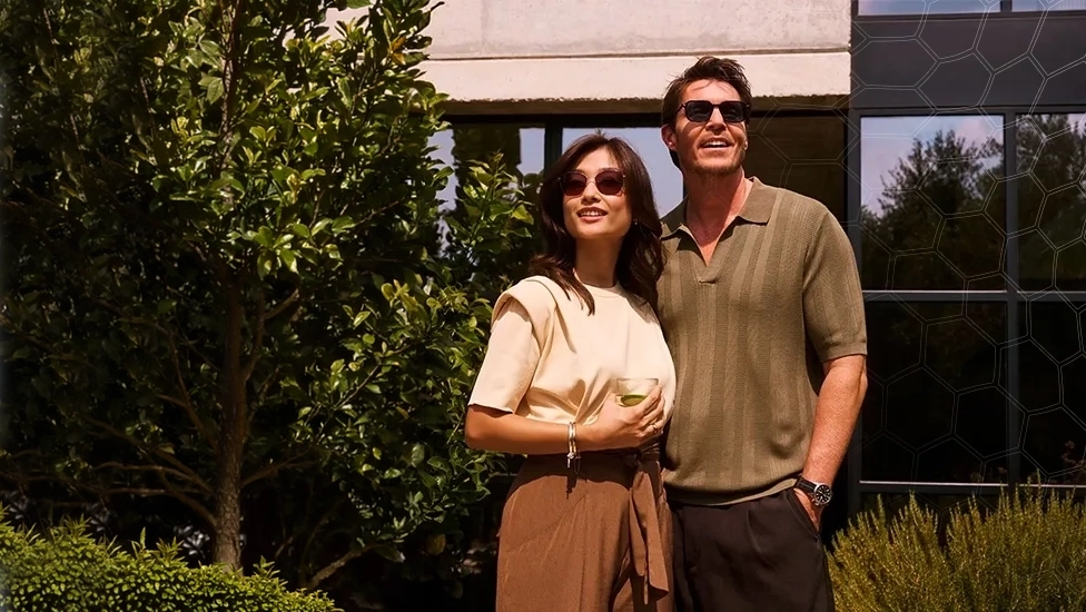 A couple wearing self-tinting lenses